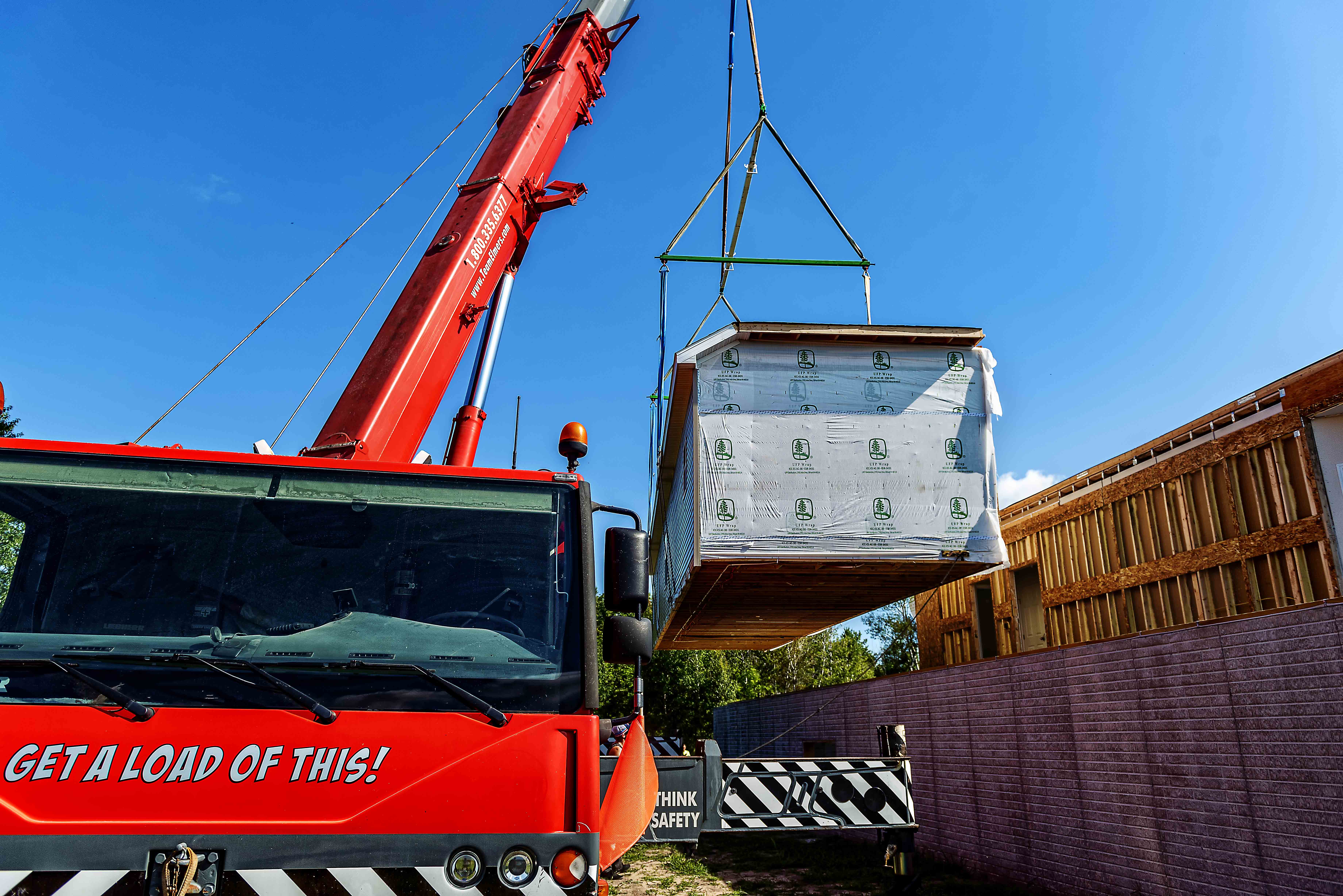 Team Elmer's Crane moving a house